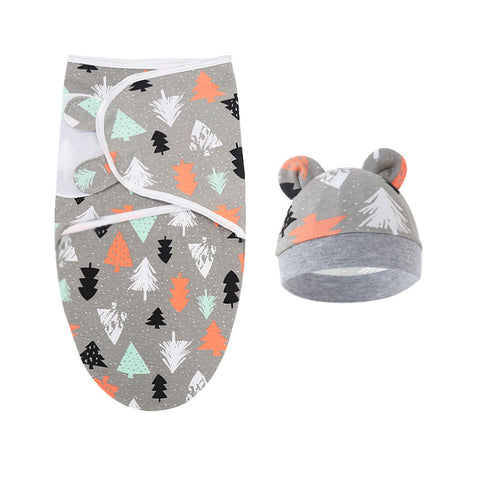Baby swaddle and hat set with forest pattern on gray background