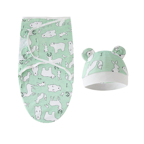 Baby swaddle and hat set with animal pattern on a white background