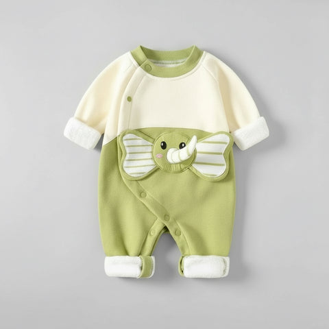 Green and white baby romper with elephant design on a gray background