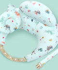 Baby support ring with colorful animal pattern on a light green background