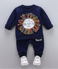 Navy blue children's outfit with lion design on a hanger against a gray background.
