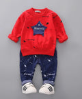Red and blue children's outfit with star design on a gray background