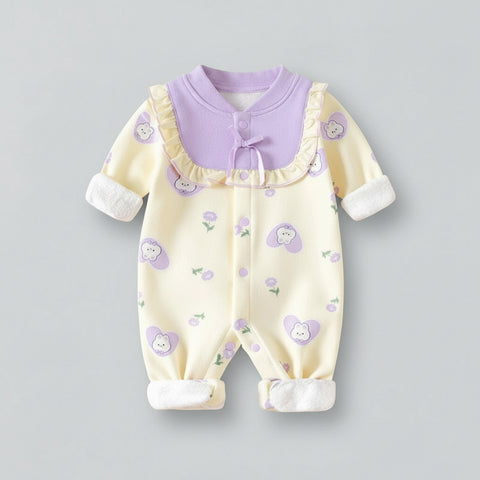 Baby romper with purple collar and white cuffs on a gray background