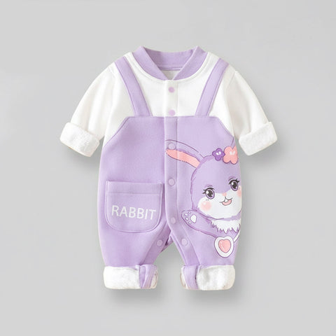 Purple baby romper with bunny design on a gray background
