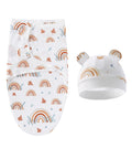 Baby swaddle with rainbow pattern and matching hat on a white background