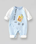 Baby onesie with cartoon design and text on a gray background