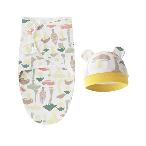 Baby swaddle and hat set with kitchen utensil pattern on a white background