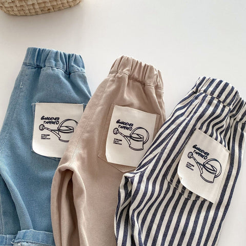 Three pairs of shorts in blue, beige, and striped pattern with branded labels on a white background.