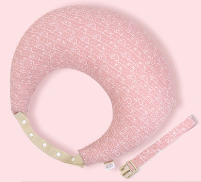 Pink baby boppy with strap on a light pink background