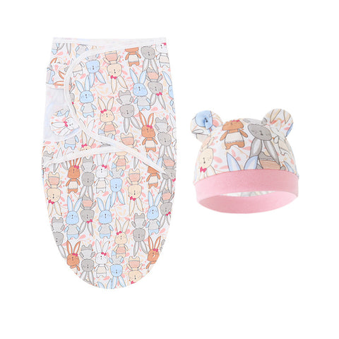 Baby swaddle and hat set with animal pattern on a white background