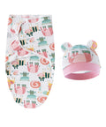 Baby swaddle and hat set with animal pattern on a white background