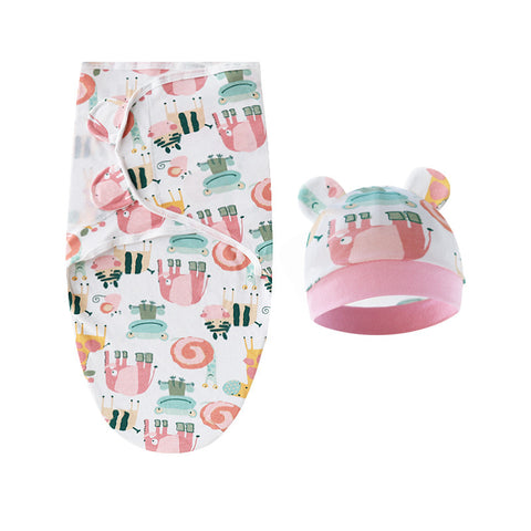 Baby swaddle and hat set with animal pattern on a white background