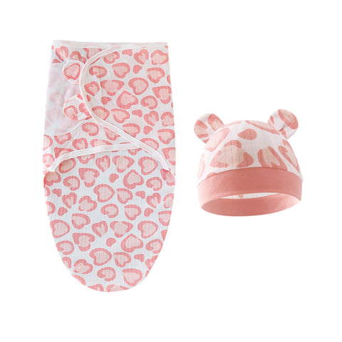 Baby swaddle and hat set with pink leopard print on a white background