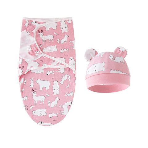 Baby swaddle and hat set with animal pattern on pink background