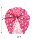 Pink headscarf with white polka dots and measurements on a white background