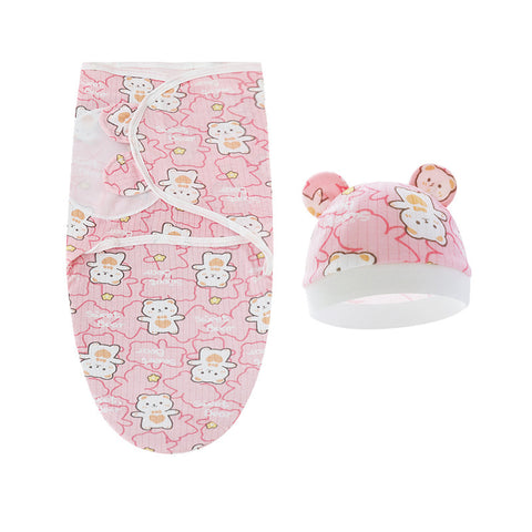 Baby swaddle and hat set with teddy bear pattern on a white background