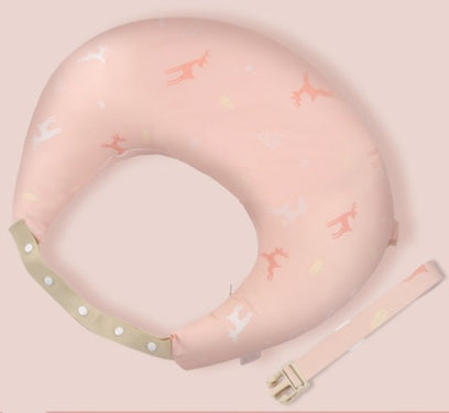 Pink neck pillow with airplane pattern on a light pink background