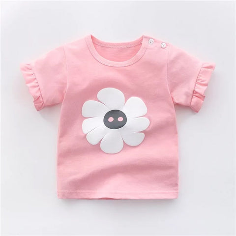 Pink children's t-shirt with a white flower design on a light gray background