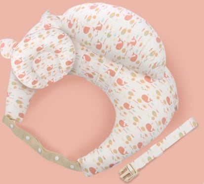 Baby support pillow with floral pattern on a pink background