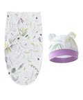 Baby swaddle and hat set with floral pattern on a white background