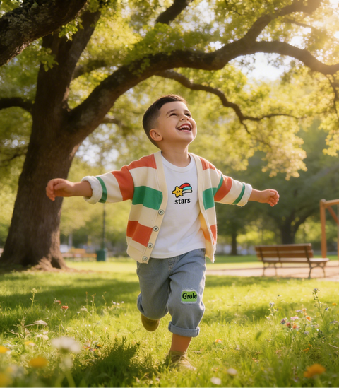 Child running in a park with a tree and bench in the background