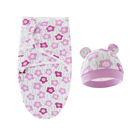 Baby swaddle and hat set with pink floral pattern on a white background