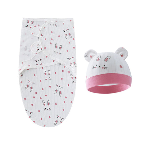 Baby swaddle and hat set with bunny pattern on a white background