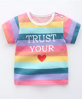 Colorful striped shirt with 'Trust Your Heart' text on a white background