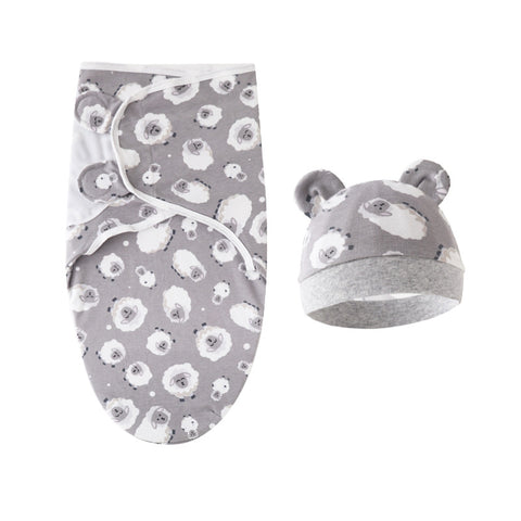 Baby swaddle and hat set with gray and white floral pattern on a white background