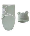 Baby swaddle and hat set in light green on a white background
