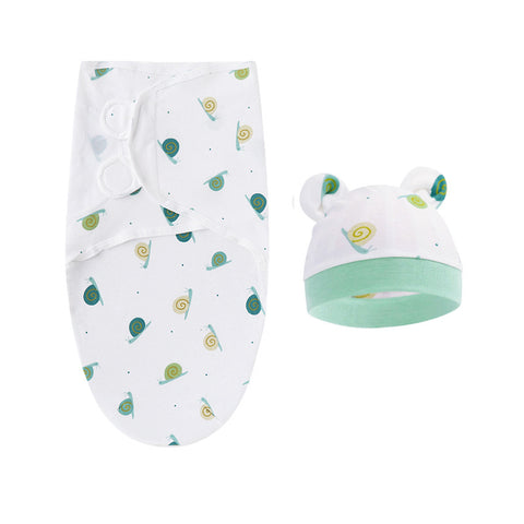 Baby swaddle and hat set with green and white pattern on a white background