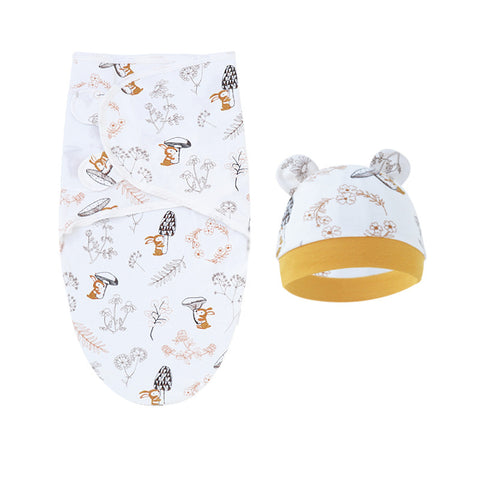 Baby swaddle and hat set with animal pattern on a white background