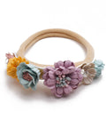 Floral hairband with colorful flowers on a white background