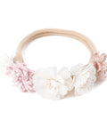 Floral headband with pink and white flowers on a white background