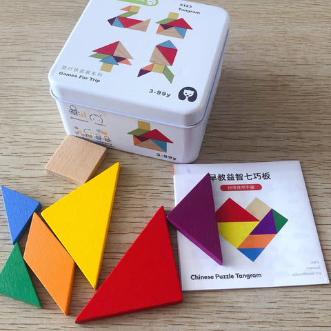 Colorful geometric puzzle pieces with a tin box on a wooden surface
