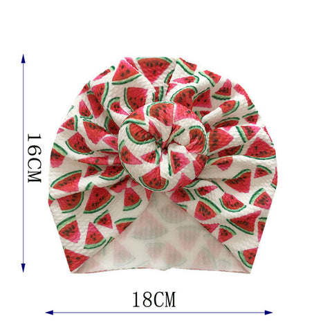Turban with watermelon pattern and measurements on a white background