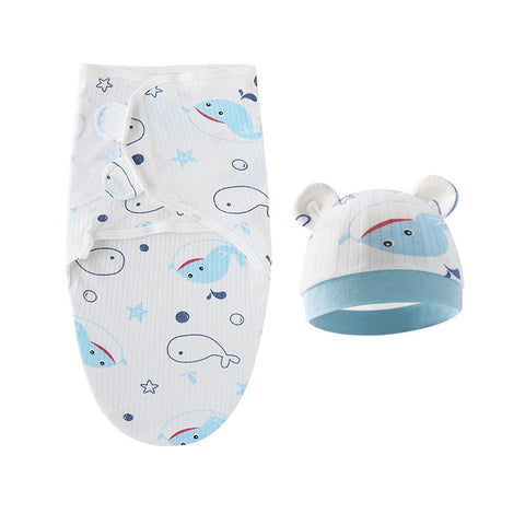 Baby swaddle and hat set with whale pattern on a white background
