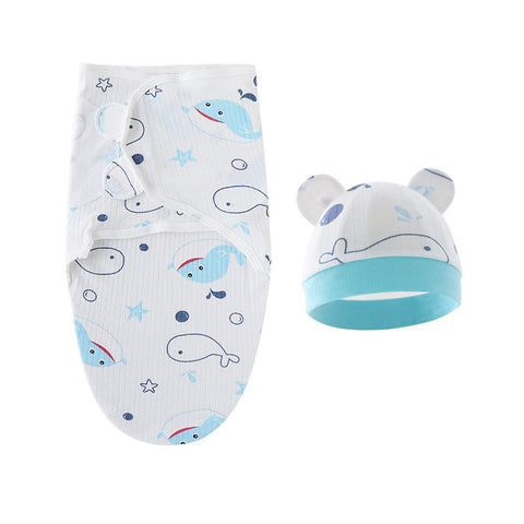 Baby swaddle and hat set with whale pattern on a white background