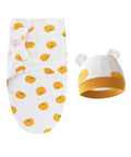 Baby swaddle with orange patterns and matching hat on a white background