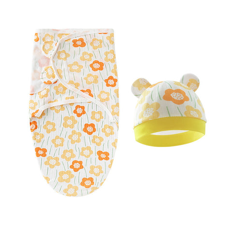 Baby swaddle and hat set with floral pattern on a white background
