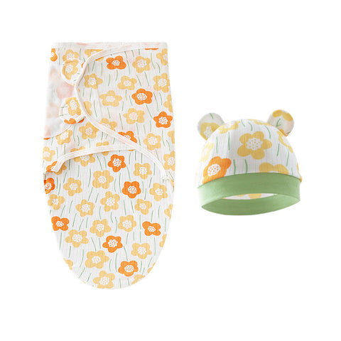 Baby swaddle and hat set with floral pattern on a white background