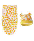 Baby swaddle and hat set with orange and yellow pattern on a white background