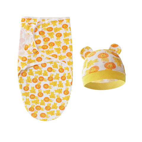 Baby swaddle and hat set with orange and yellow pattern on a white background