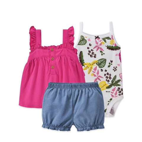 Set of children's clothing including a pink top, blue shorts, and a floral-patterned onesie on a white background.