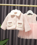 Children's pink textured jacket and dress set.