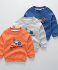 Three children's sweatshirts in orange, gray, and blue with vehicle graphics on a white background.