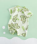 Baby outfit with green and white design on a light green background