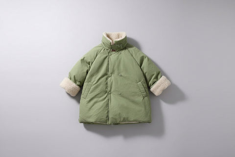 Green winter coat with fleece-lined cuffs on a white background