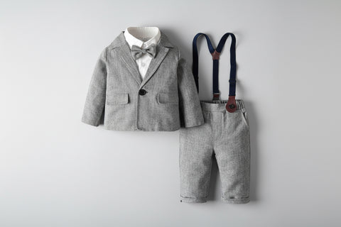 Children's gray suit with bow tie and suspenders on a light gray background