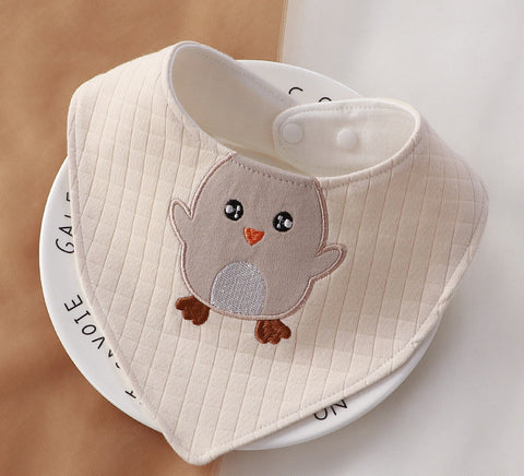 Baby bib with owl design on a white surface